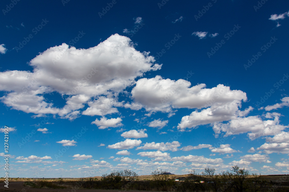White fluffy clouds over prarie White fluffy clouds over prarie