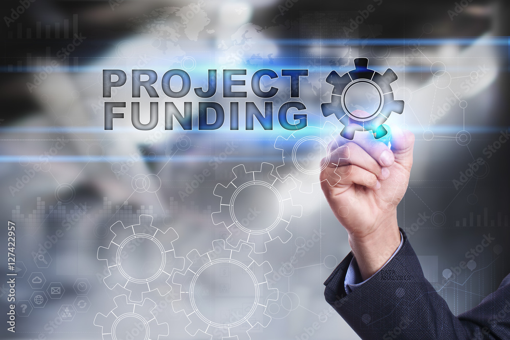 Businessman is drawing on virtual screen. project funding concept Businessman is drawing on virtual screen. project funding concept