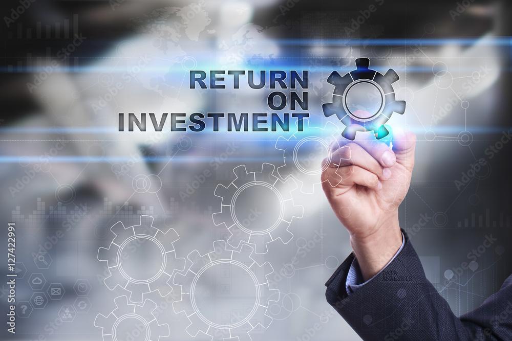 Businessman is drawing on virtual screen. return on investment concept Businessman is drawing on virtual screen. return on investment concept