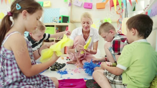 Children Making Paper Flowers at the Kindergarten
