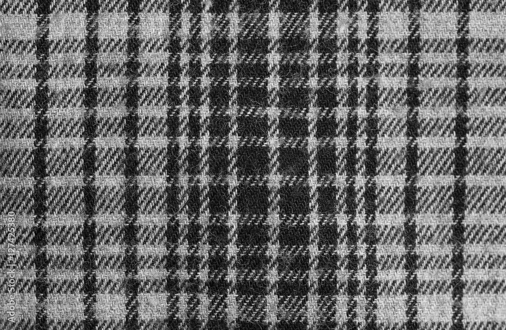 Texture of grey checkered fabric. Cotton fabric close-up.