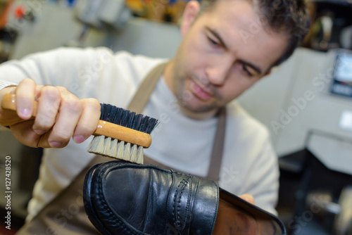 brushing a shoe