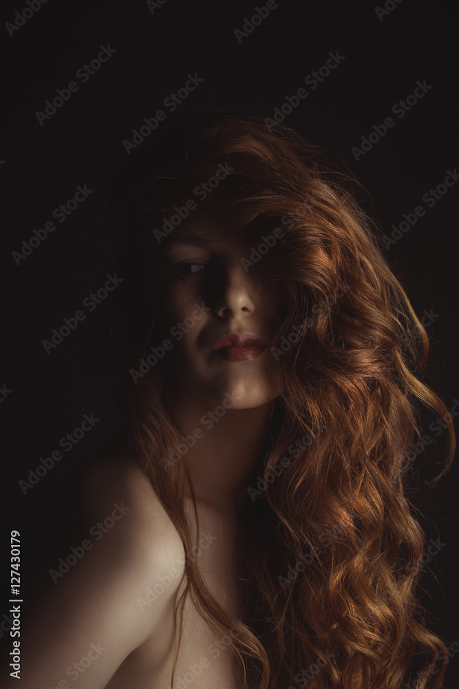 Tender woman with naked shoulders and lush hair Tender woman with naked shoulders and lush hair