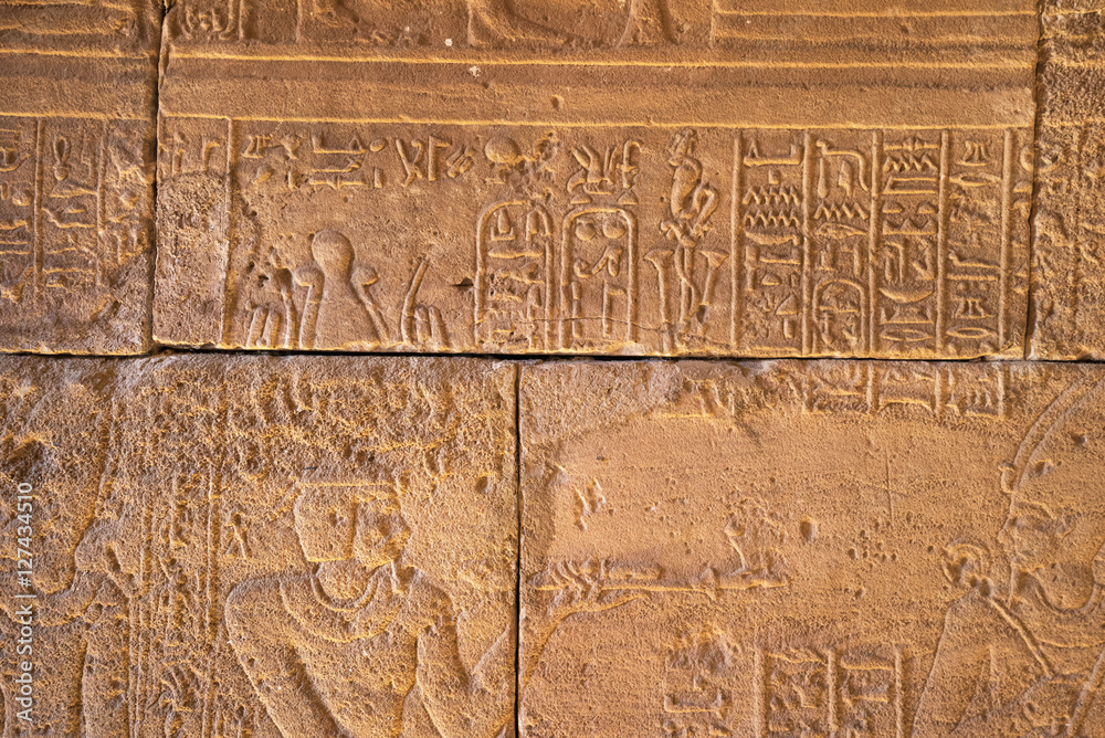 Real Hieroglyphic carvings on the walls of an ancient egyptian templ Real Hieroglyphic carvings on the walls of an ancient egyptian templ
