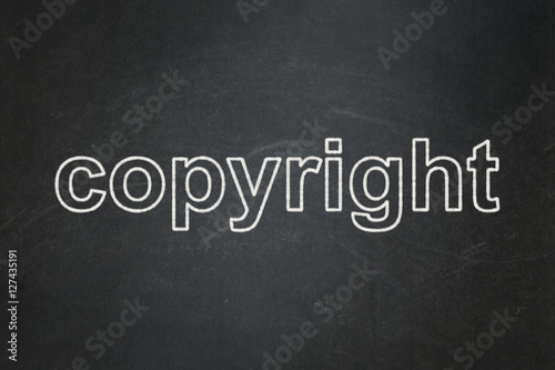 Law concept: Copyright on chalkboard background