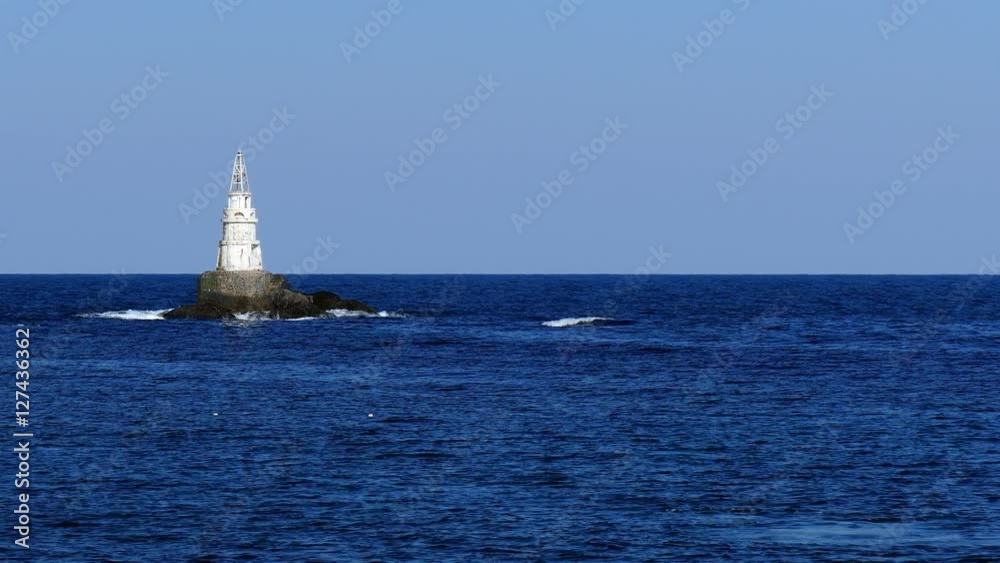 Old lighthouse. Bulgarian Black Sea Coast. Quiet blue sea blue sky. Horizon. Old lighthouse. Bulgarian Black Sea Coast. Quiet blue sea blue sky. Horizon.