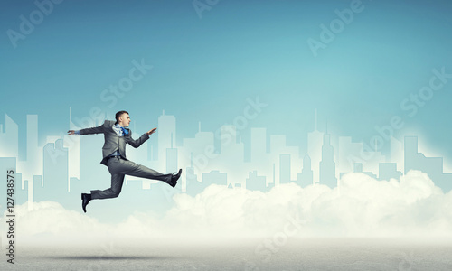 Businessman jumping high © adam121