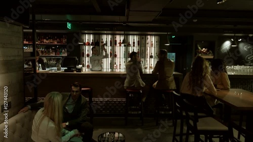 People having dinner at a restaurant. 
