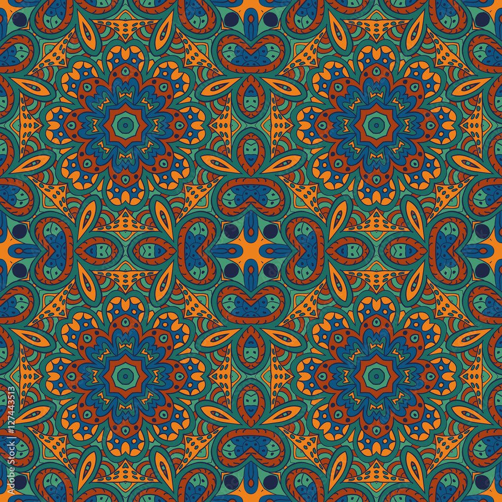 Seamless pattern doodle ornament. Colorful background. Ethnic motives. Zentangl. Orange, green and blue