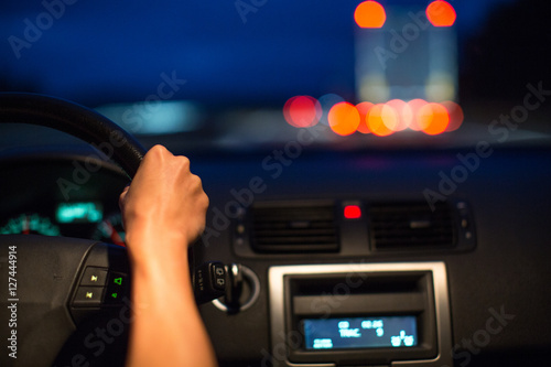Female drive driving a car at night