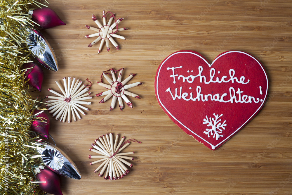Christmas heart shaped decoration on wooden background Christmas heart shaped decoration on wooden background