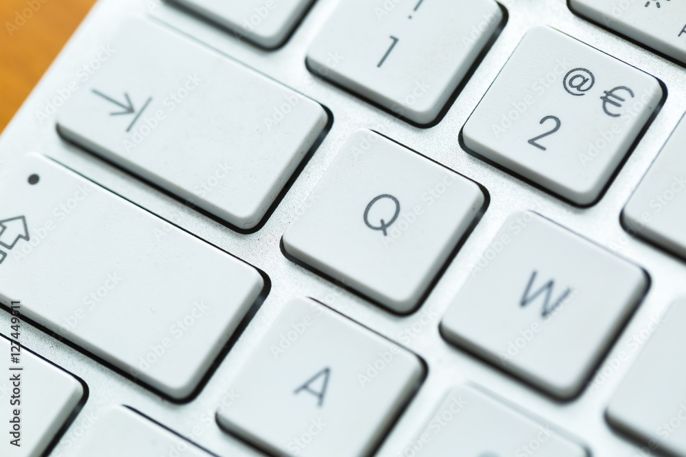 Close up of white wireless aluminum keyboard Close up of white wireless aluminum keyboard