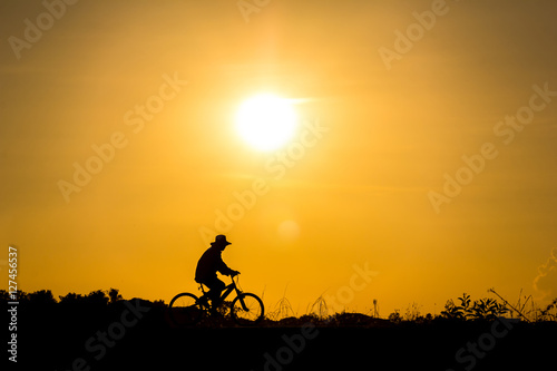 Silhouette of cyclist in motion