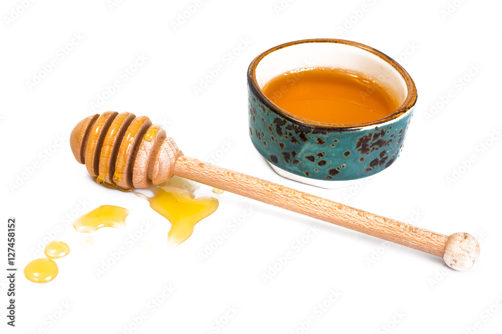 Honey dipper and fragrant into a bowl Honey dipper and fragrant into a bowl