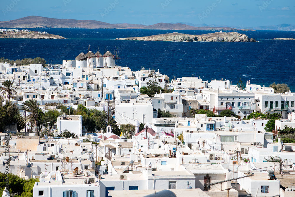 View over Mykonos town at noon including the famous windmills