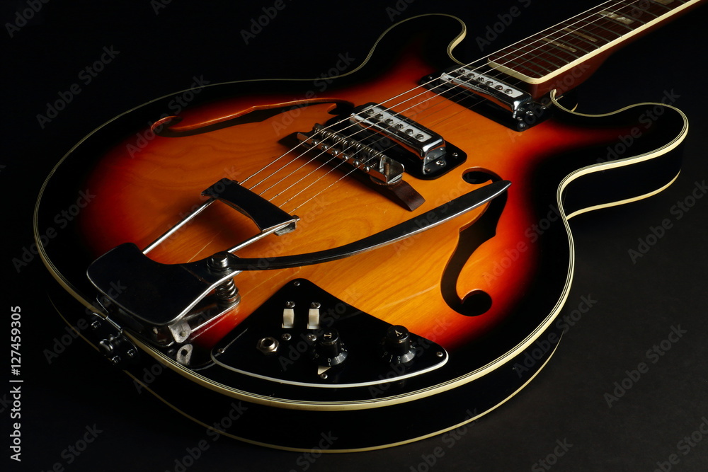 Obraz premium Hollow Body Guitar on Black Background