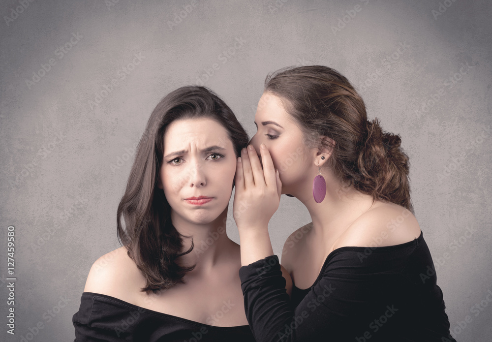 girl telling secret things to her girlfriend girl telling secret things to her girlfriend
