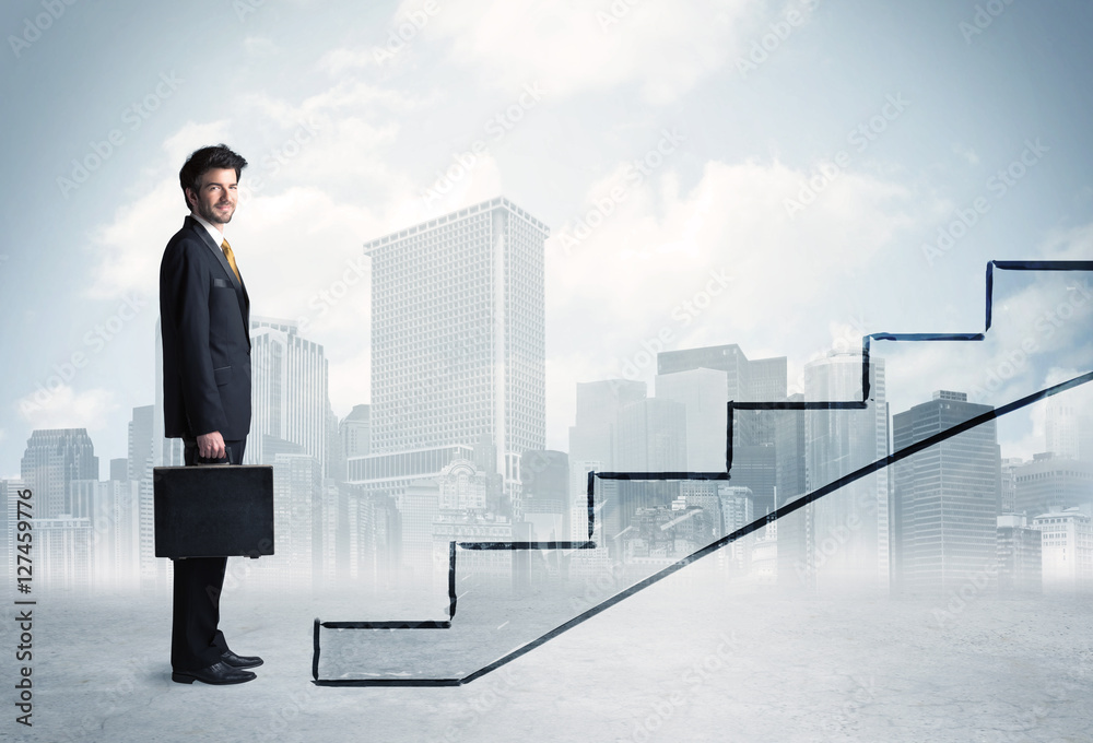 Business person in front of a staircase Business person in front of a staircase