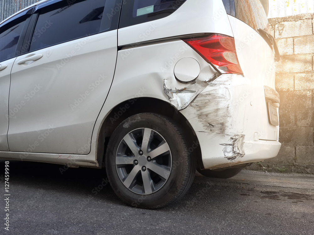 Details of a white car in an accident, Car crash, insurance, soft focus, light effect.