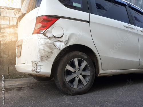 Details of a white car in an accident, Car crash, insurance, soft focus, light effect.