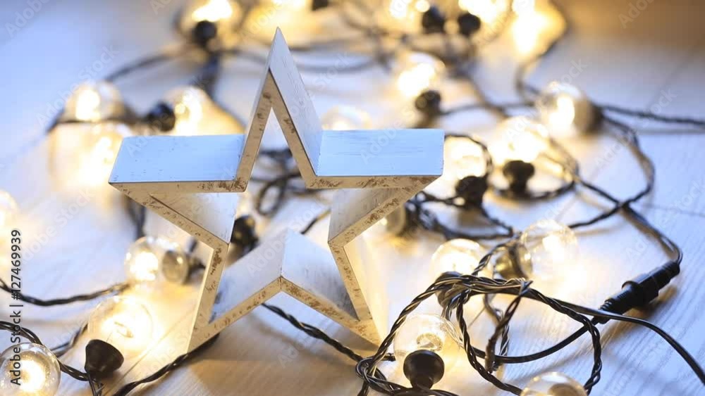 Christmas start and lights on wooden background Christmas start and lights on wooden background