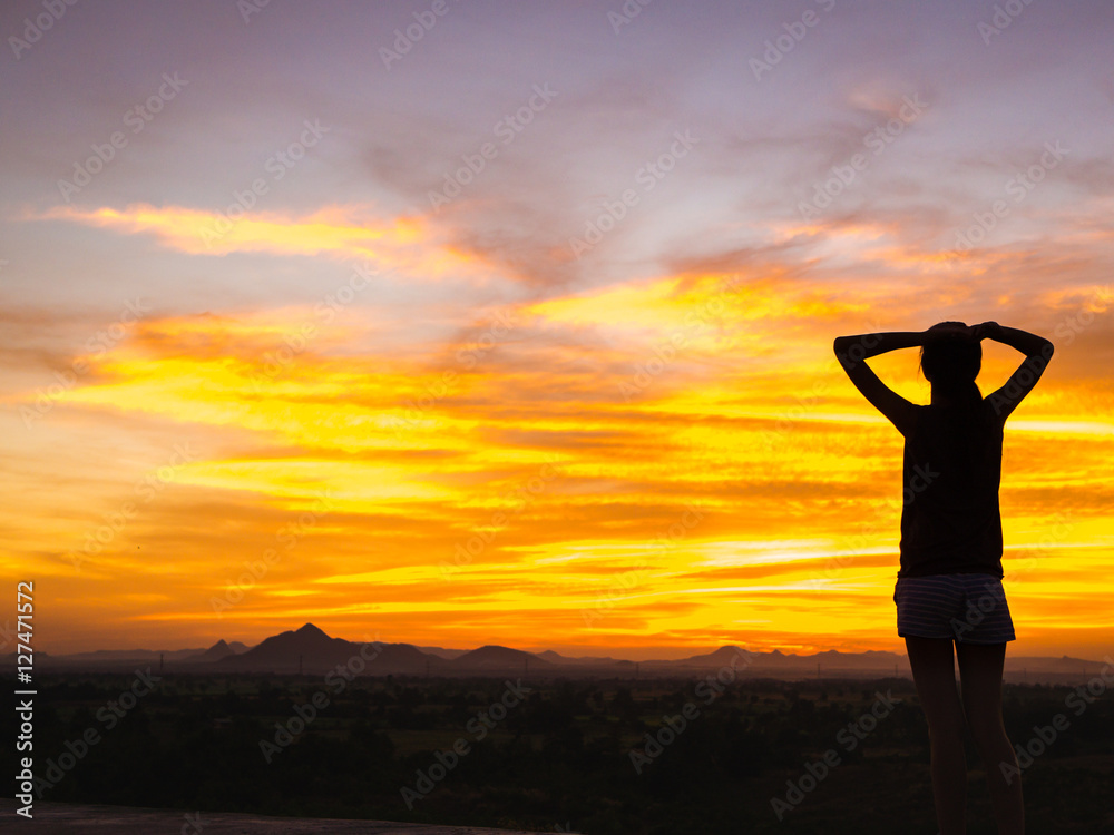 Free happy woman enjoying nature sunset. Freedom, happiness and enjoyment concept of young multiracial Asian