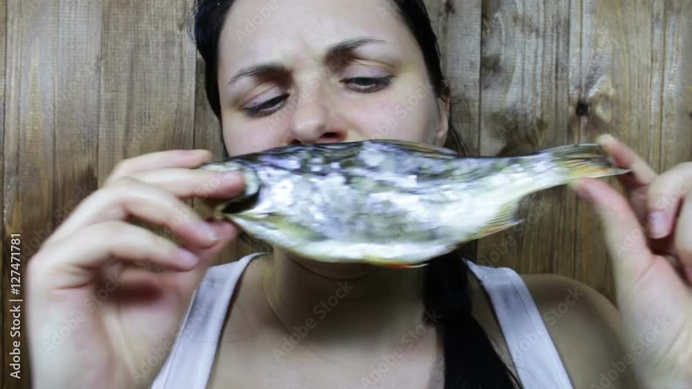 Girl holding a stinky fish