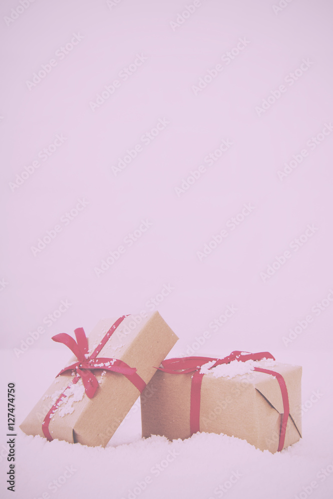 Christmas presents in brown paper with red ribbon Vintage Retro Christmas presents in brown paper with red ribbon Vintage Retro