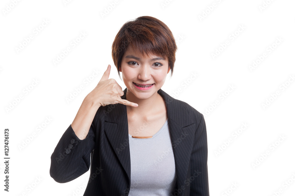 Young Asian woman show with phone gesture. Young Asian woman show with phone gesture.