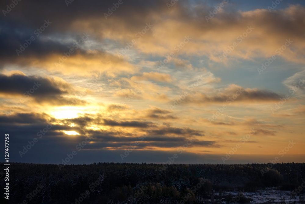 Sunset over the winter forest