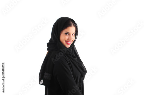 Attractive Arabian Woman Wearing Hijab standing over a white background