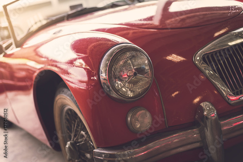 Close up headlight of red Retro classic car © Kittiphan