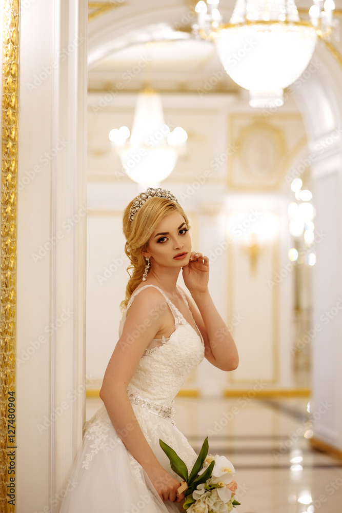 beautiful young woman bride in luxury wedding dress in interior beautiful young woman bride in luxury wedding dress in interior
