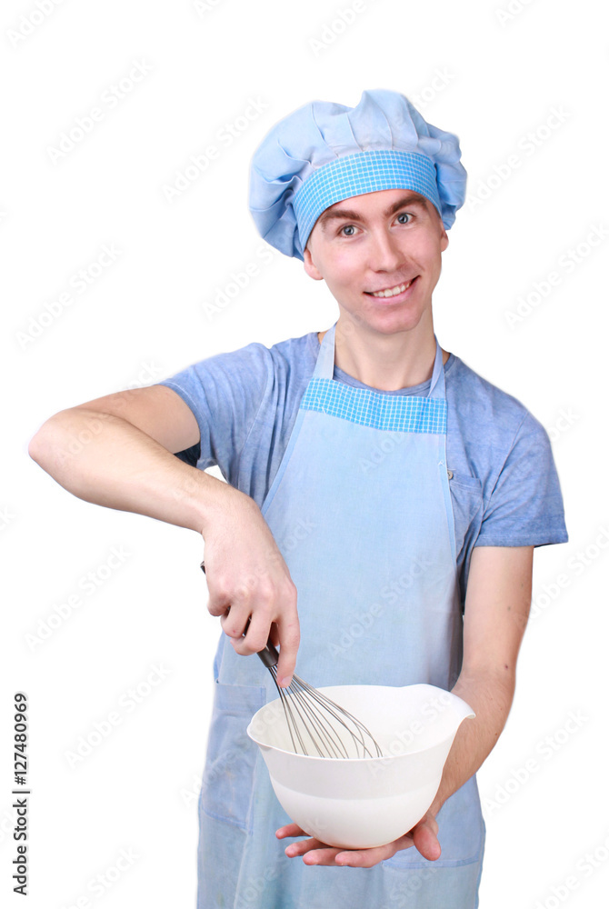 young, happy chef holding a whisk and a bowl young, happy chef holding a whisk and a bowl