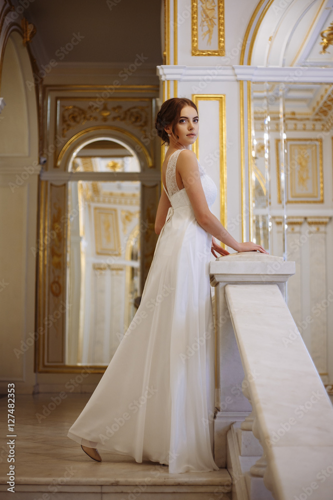 beautiful young woman bride in luxury wedding dress in interior beautiful young woman bride in luxury wedding dress in interior