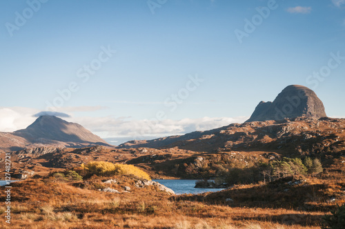 A landscape image looking across to Suilven and Canisp, mountains in Assynt, in the Scottish highlands.