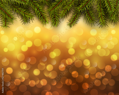 Christmas abstract background orange blinking bokeh with fir tree.