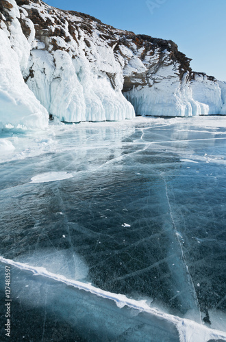 Winter landscape with ice on coastal rocks of Lake Baikal