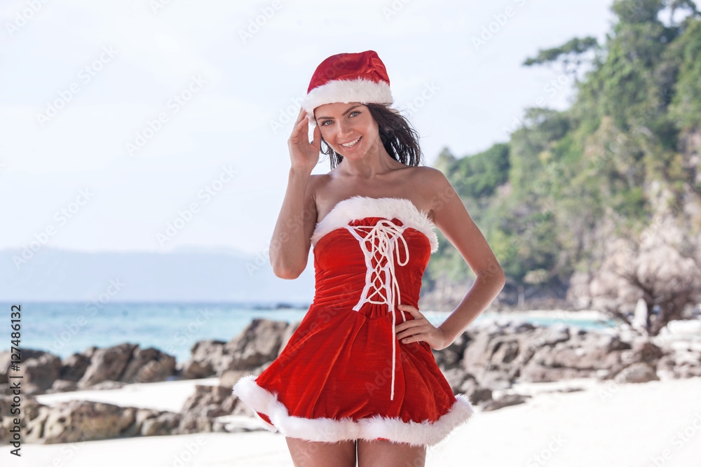 Obraz premium Mrs. Claus on tropical beach