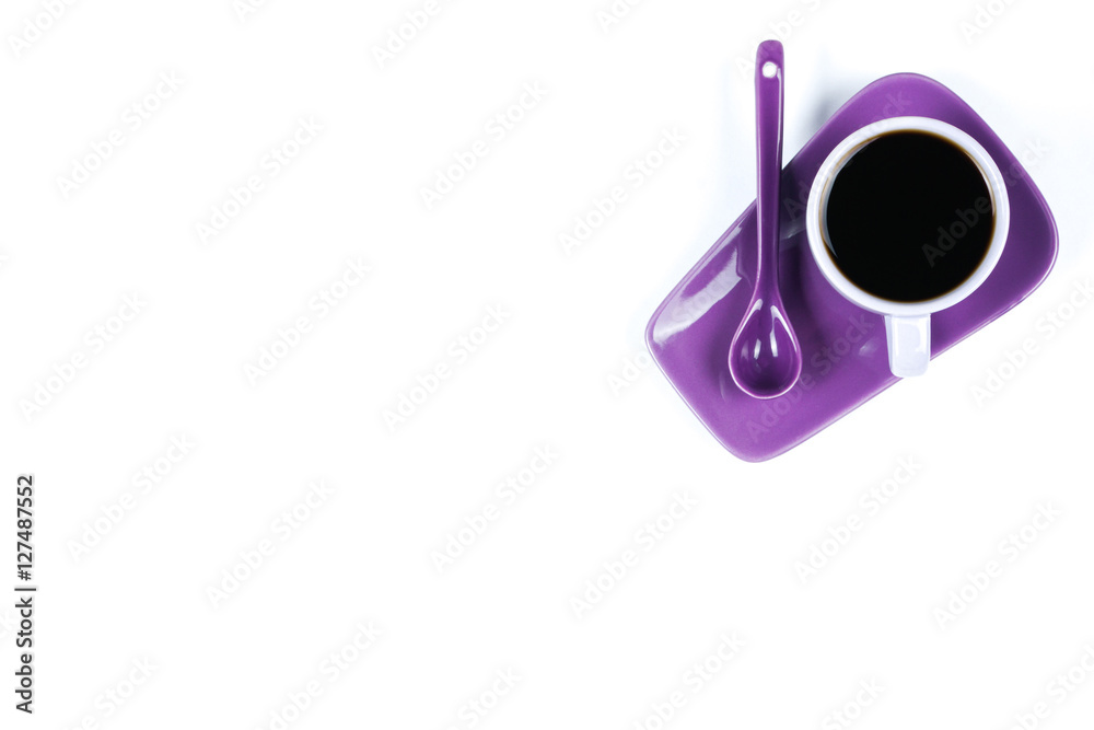 Purple coffee cup with saucer and spoon isolated on white background Purple coffee cup with saucer and spoon isolated on white background