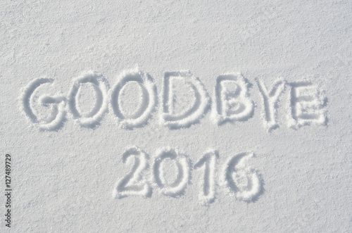 Goodbye 2016 handwritten on flat snow surface. Horizontal new year holiday postcard, greeting card.