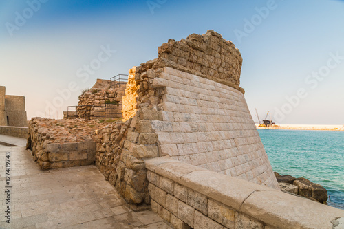  walls of the harbor of old town in Italy