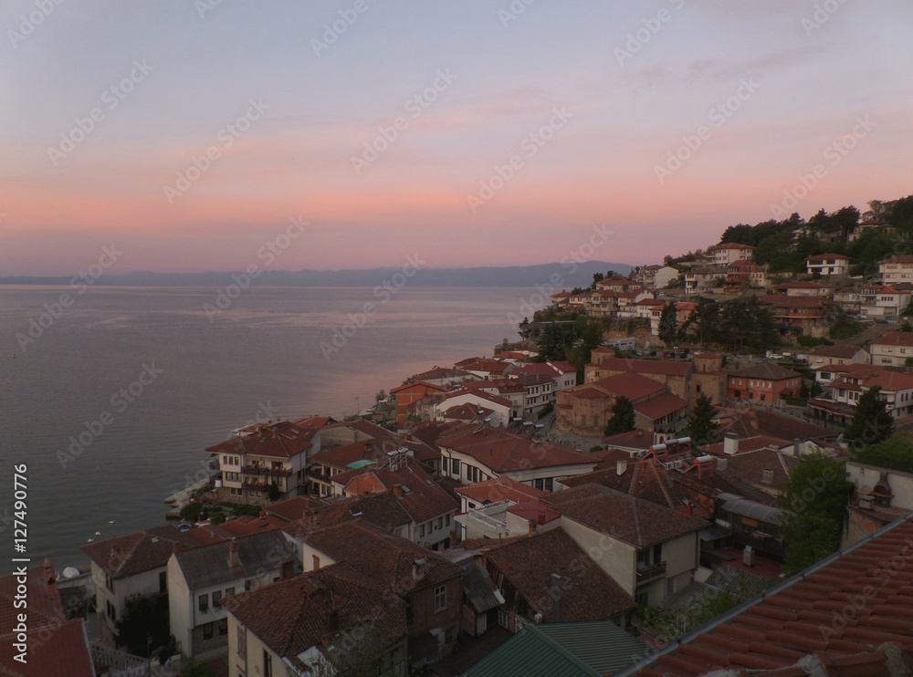 Cityscape on the shores of Lake Ohrid in a breathtaking morning pink sky, Macedonia 