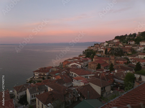 Cityscape on the shores of Lake Ohrid in a breathtaking morning pink sky, Macedonia 