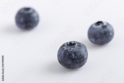 fresh juicy blueberries on white background