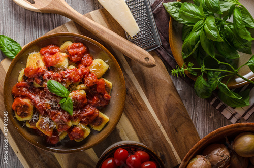 Roasted gnocchi with tomato souce photo