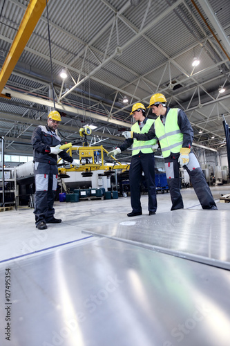 Workers working with aluminium billets