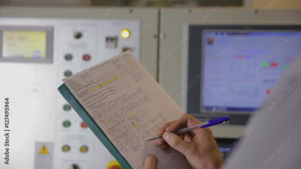 Industrial worker operating control paanel in control room of a industrial power factory. HD. Industrial worker operating control paanel in control room of a industrial power factory. HD.