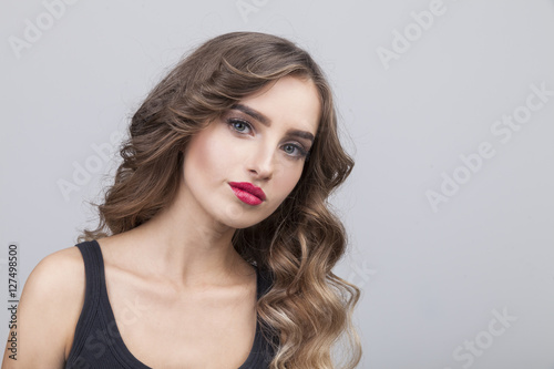 Sceptic woman with long brown hair