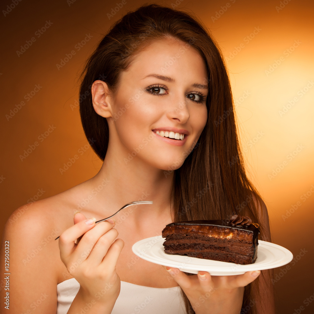 chocolate cake - glamorous woman eats dessert chocolate cake - glamorous woman eats dessert